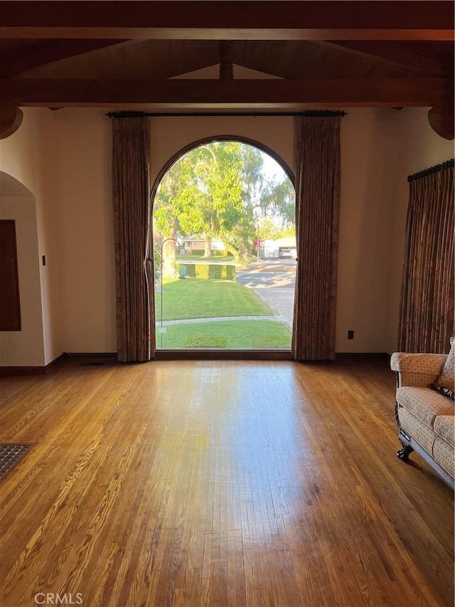 1465 N Euclid Ave, Upland, CA 91786 - unfurnished living room with beam ceiling, wood finished floors, and arched walkways
