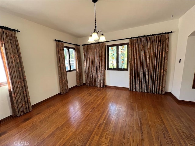1465 N Euclid Ave, Upland, CA 91786 - unfurnished room with wood finished floors, a chandelier, and baseboards