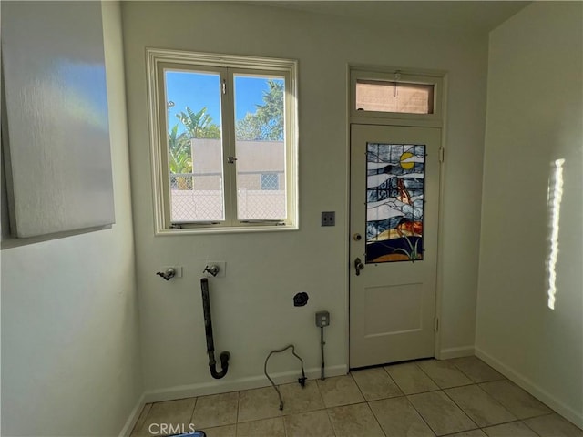 1465 N Euclid Ave, Upland, CA 91786 - laundry area with baseboards, light tile patterned floors, and hookup for a washing machine