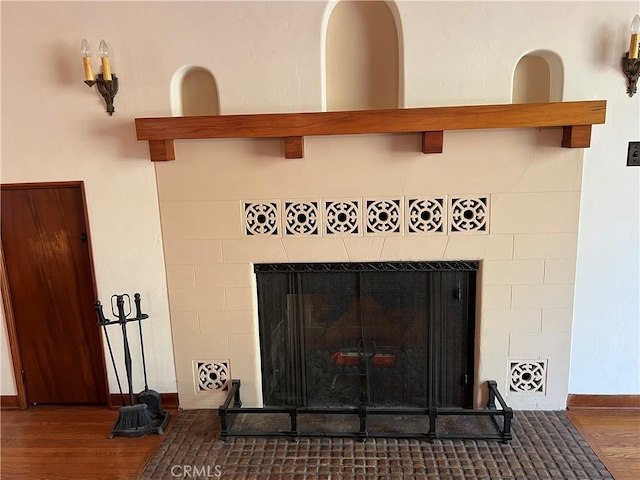 1465 N Euclid Ave, Upland, CA 91786 - detailed view of a tile fireplace, wood finished floors, and baseboards