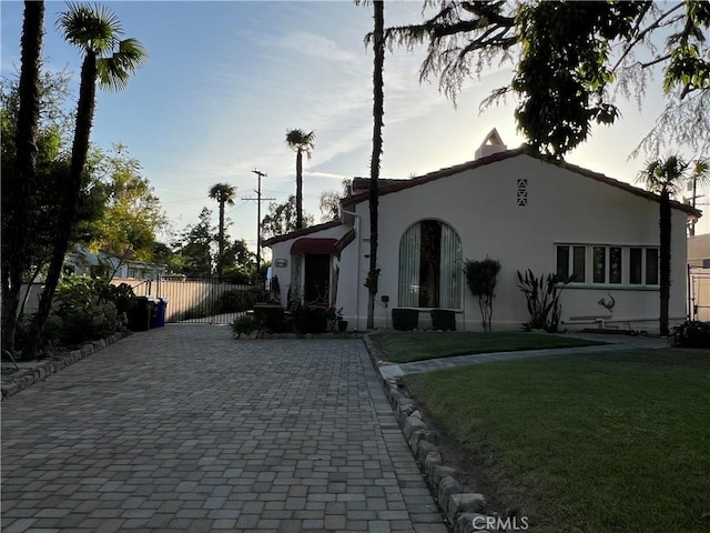 1465 N Euclid Ave, Upland, CA 91786 - mediterranean / spanish-style home featuring stucco siding, a gate, and driveway