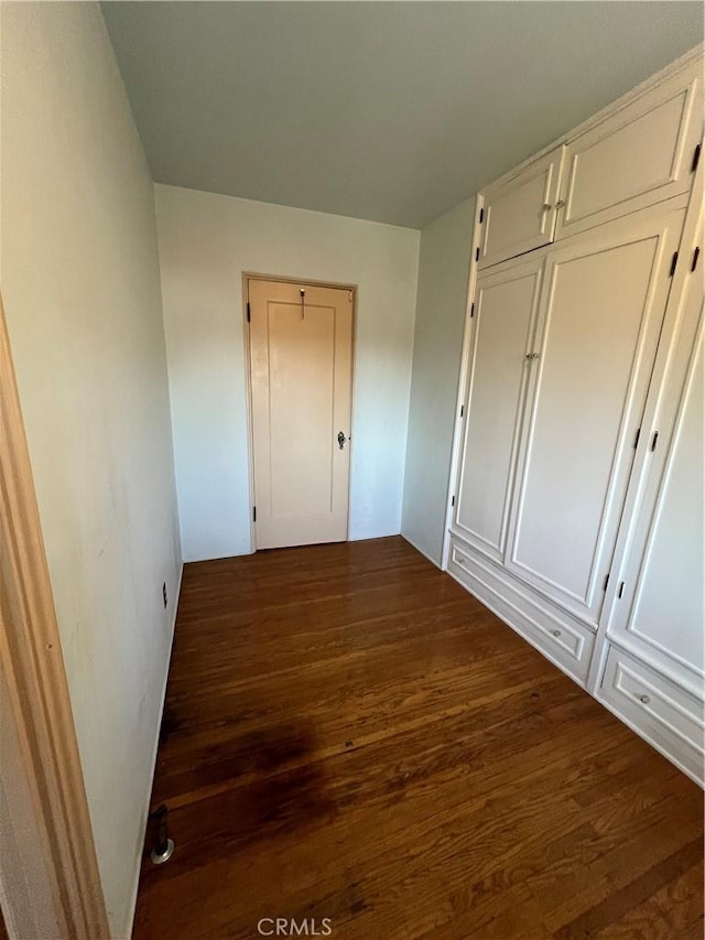 1465 N Euclid Ave, Upland, CA 91786 - unfurnished bedroom with dark wood-style floors and a closet