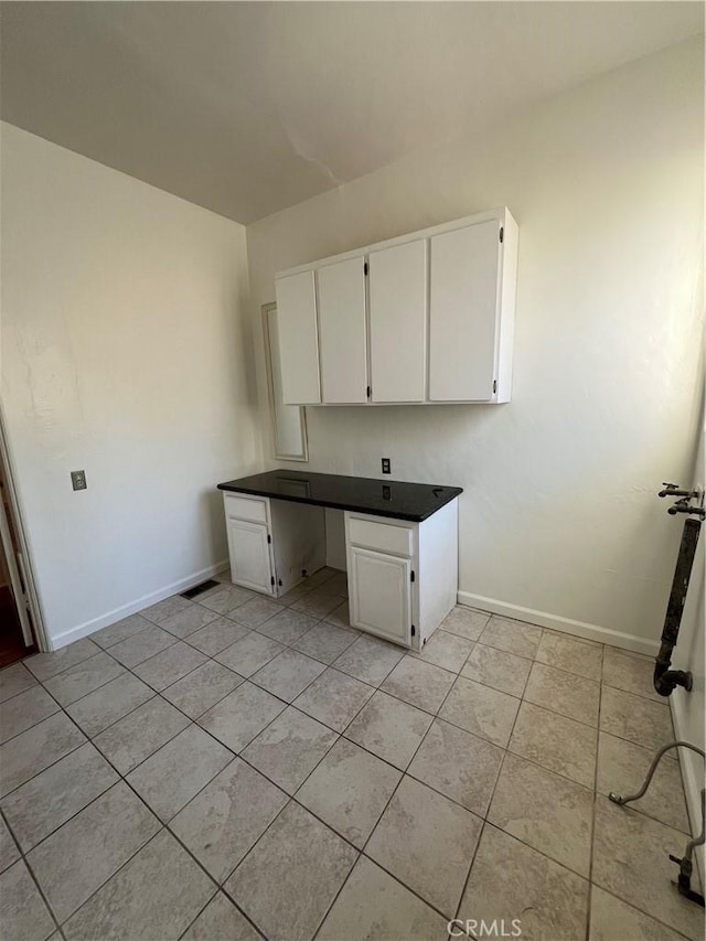 1465 N Euclid Ave, Upland, CA 91786 - kitchen featuring white cabinets, light tile patterned flooring, baseboards, and dark countertops