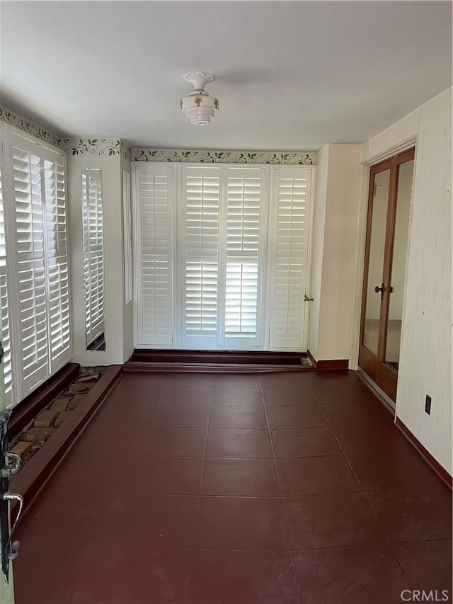 1465 N Euclid Ave, Upland, CA 91786 - spare room featuring dark tile patterned floors and baseboards