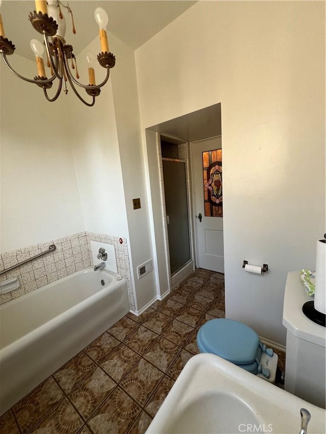 1465 N Euclid Ave, Upland, CA 91786 - bathroom with a chandelier, a garden tub, a stall shower, baseboards, and toilet