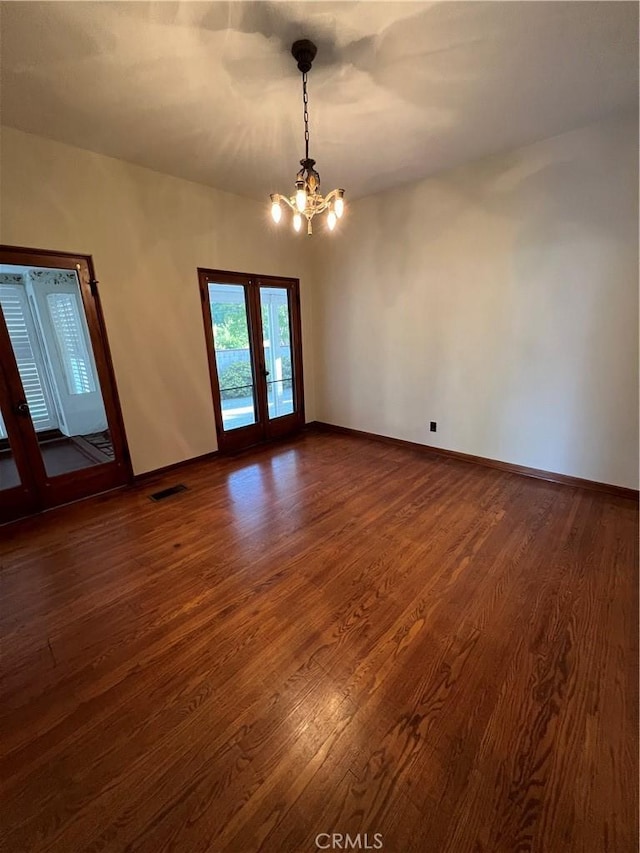 1465 N Euclid Ave, Upland, CA 91786 - unfurnished room featuring french doors, a chandelier, dark wood-style flooring, and baseboards