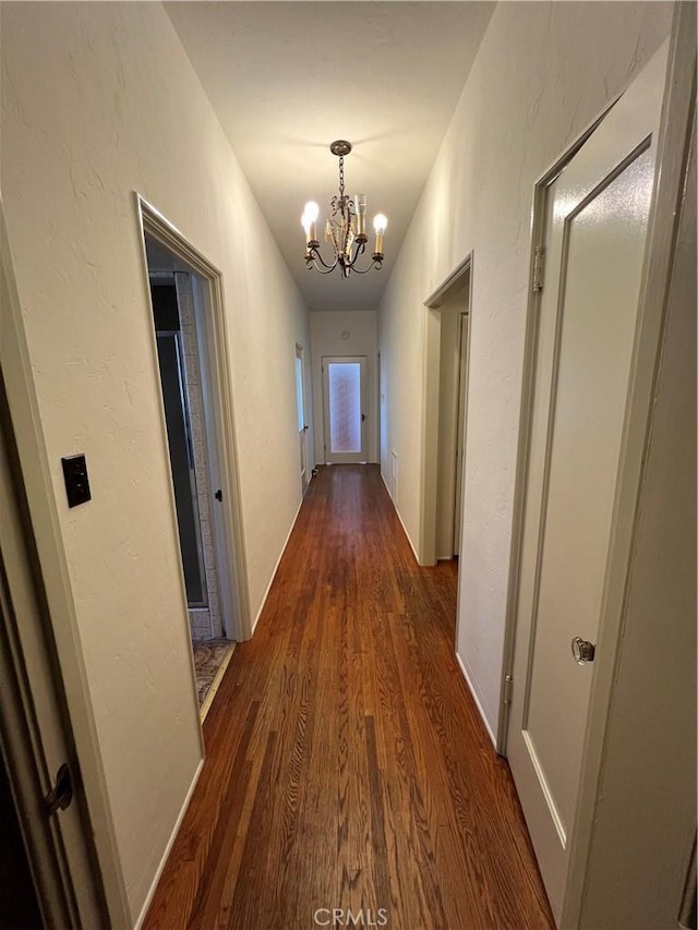 1465 N Euclid Ave, Upland, CA 91786 - corridor featuring dark wood-type flooring and a chandelier