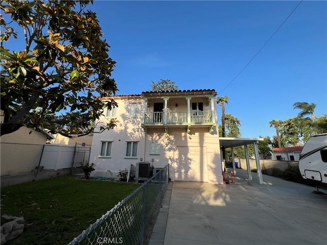 1465 N Euclid Ave, Upland, CA 91786 - back of property with driveway, central AC, a balcony, stucco siding, and an attached garage