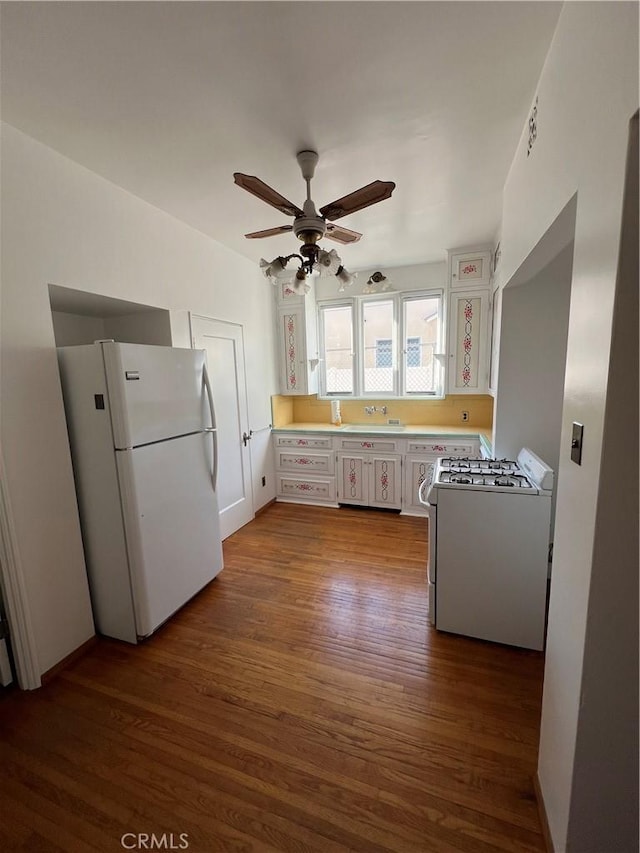1465 N Euclid Ave, Upland, CA 91786 - kitchen featuring white appliances, dark wood finished floors, a ceiling fan, and white cabinetry