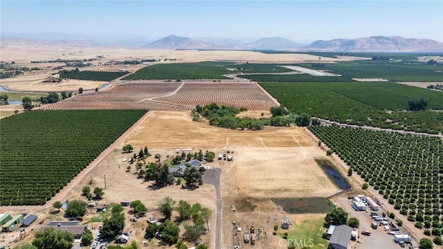 3298 N Zediker Ave, Sanger, CA 93657 - aerial view of sparsely populated area featuring farmland and a mountain backdrop