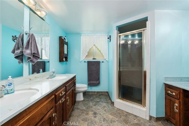 3298 N Zediker Ave, Sanger, CA 93657 - full bath with double vanity, a shower stall, and toilet