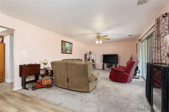 3298 N Zediker Ave, Sanger, CA 93657 - living area featuring wood finished floors, ceiling fan, and baseboards