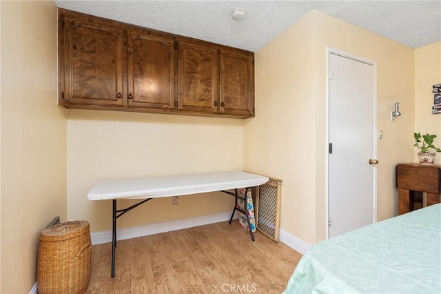3298 N Zediker Ave, Sanger, CA 93657 - bedroom featuring light wood finished floors, baseboards, and a textured ceiling
