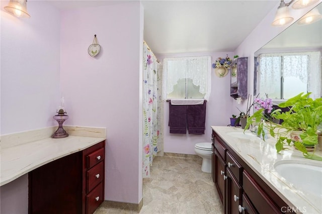 3298 N Zediker Ave, Sanger, CA 93657 - bathroom with double vanity, toilet, and a shower with curtain