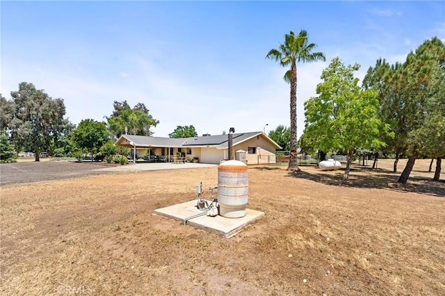 3298 N Zediker Ave, Sanger, CA 93657 - view of front of home with a garage and solar panels
