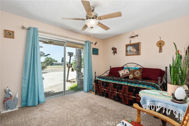 3298 N Zediker Ave, Sanger, CA 93657 - carpeted bedroom featuring access to exterior, a textured ceiling, and ceiling fan