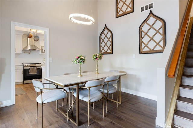 1319 Via Esperanza, San Dimas, CA 91773 - dining space featuring stairs, wood finished floors, baseboards, and a high ceiling