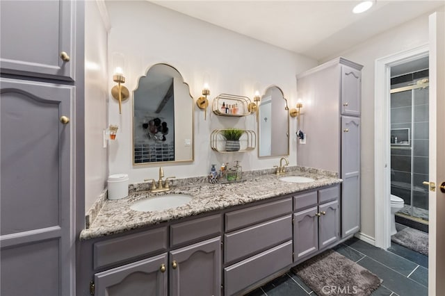 1319 Via Esperanza, San Dimas, CA 91773 - full bath with double vanity, toilet, tiled shower, and tile patterned flooring