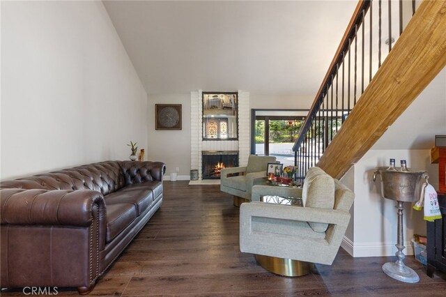 1319 Via Esperanza, San Dimas, CA 91773 - living room featuring a brick fireplace, baseboards, wood finished floors, lofted ceiling, and stairway