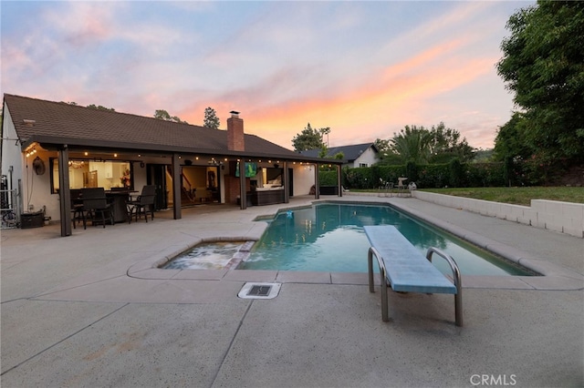 1319 Via Esperanza, San Dimas, CA 91773 - pool at dusk featuring a patio area and a pool with connected hot tub