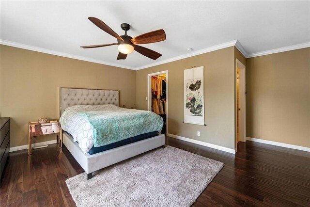 1535 S Bentley Ave Unit 202, Los Angeles, CA 90025 - bedroom featuring ornamental molding, dark wood-style floors, baseboards, a closet, and a walk in closet
