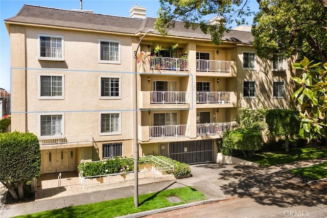 1535 S Bentley Ave Unit 202, Los Angeles, CA 90025 - view of apartment building / complex with concrete driveway