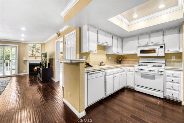 1535 S Bentley Ave Unit 202, Los Angeles, CA 90025 - kitchen featuring white appliances, crown molding, dark wood-type flooring, open floor plan, and a sink