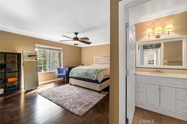 1535 S Bentley Ave Unit 202, Los Angeles, CA 90025 - bedroom featuring a sink, baseboards, ornamental molding, wood finished floors, and ceiling fan