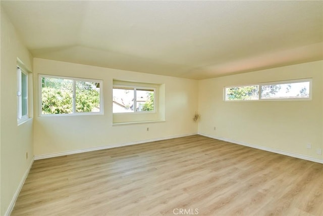 13855 Calada Dr, Moreno Valley, CA 92553 - unfurnished room with plenty of natural light, light wood-style flooring, and baseboards