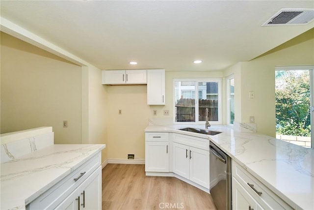 13855 Calada Dr, Moreno Valley, CA 92553 - kitchen featuring dishwasher, a sink, light wood-type flooring, white cabinetry, and recessed lighting