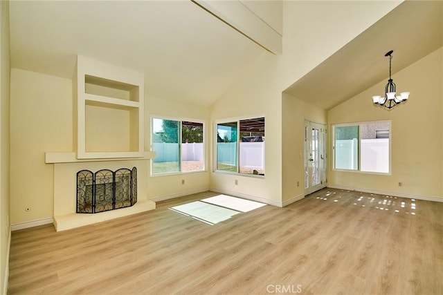13855 Calada Dr, Moreno Valley, CA 92553 - unfurnished living room featuring a chandelier, wood finished floors, baseboards, high vaulted ceiling, and beamed ceiling