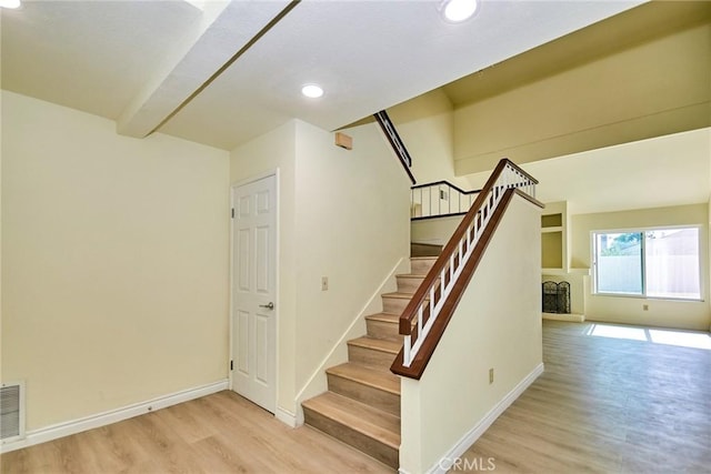 13855 Calada Dr, Moreno Valley, CA 92553 - stairs featuring wood finished floors, baseboards, recessed lighting, and beamed ceiling