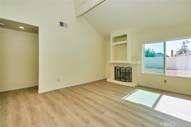 13855 Calada Dr, Moreno Valley, CA 92553 - unfurnished living room with light wood-style flooring, baseboards, and a fireplace with raised hearth