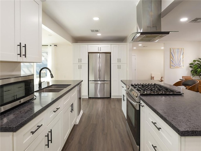 5518 W 117th St, Hawthorne, CA 90304 - kitchen with stainless steel appliances, island exhaust hood, a sink, dark wood-style flooring, and white cabinetry