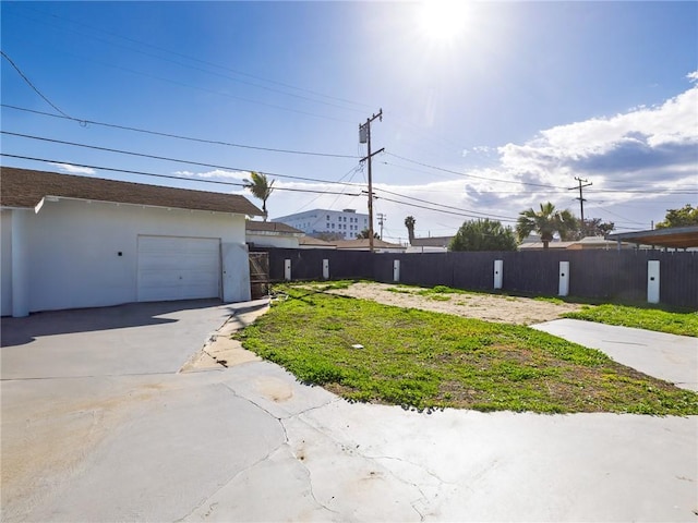 5518 W 117th St, Hawthorne, CA 90304 - view of yard featuring driveway and a garage