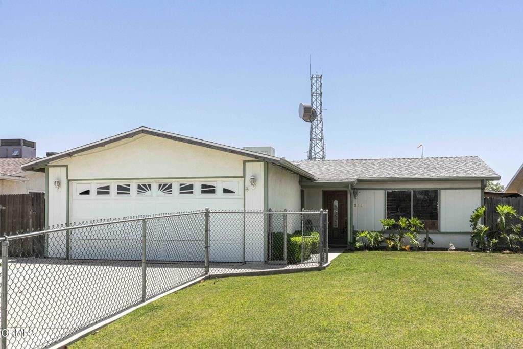 1215 Mckinley Ave, Bakersfield, CA 93308 - ranch-style house featuring an attached garage and driveway
