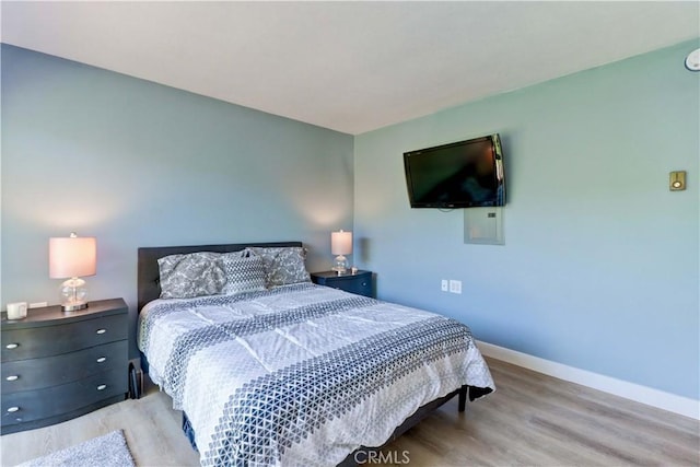 259 Calle Aragon Unit A, Laguna Woods, CA 92637 - bedroom with baseboards and wood finished floors