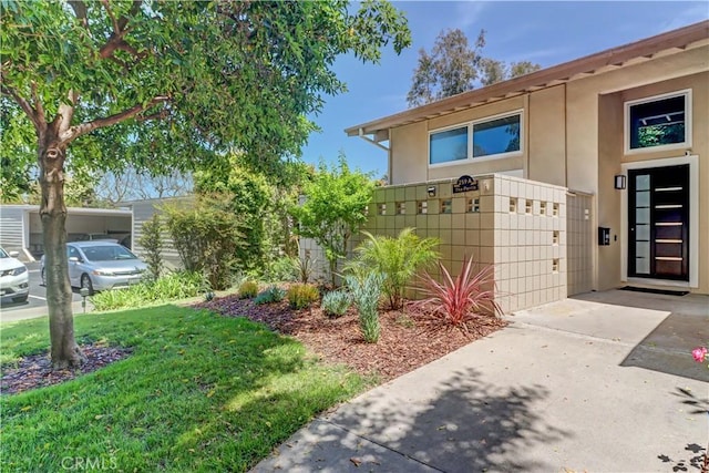 259 Calle Aragon Unit A, Laguna Woods, CA 92637 - view of exterior entry featuring stucco siding