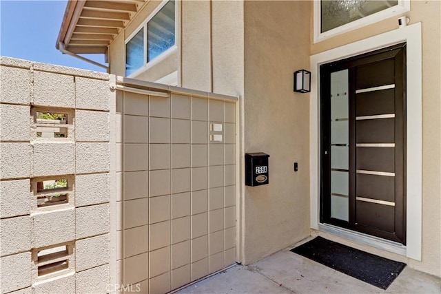 259 Calle Aragon Unit A, Laguna Woods, CA 92637 - view of exterior entry with stucco siding