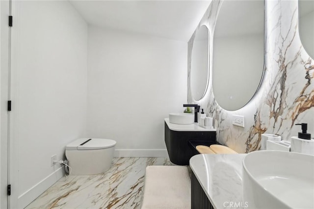 4816 Saint Andrews Ave, Buena Park, CA 90621 - bathroom with baseboards, marble finish flooring, toilet, and double vanity