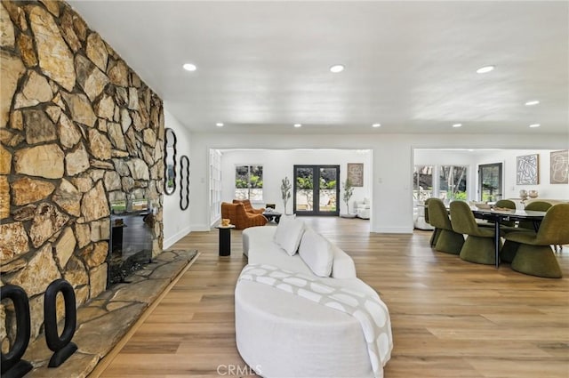 4816 Saint Andrews Ave, Buena Park, CA 90621 - living area featuring recessed lighting, light wood-style flooring, baseboards, and a fireplace