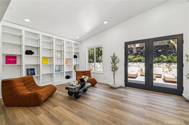 4816 Saint Andrews Ave, Buena Park, CA 90621 - living area with french doors, lofted ceiling, wood finished floors, recessed lighting, and baseboards