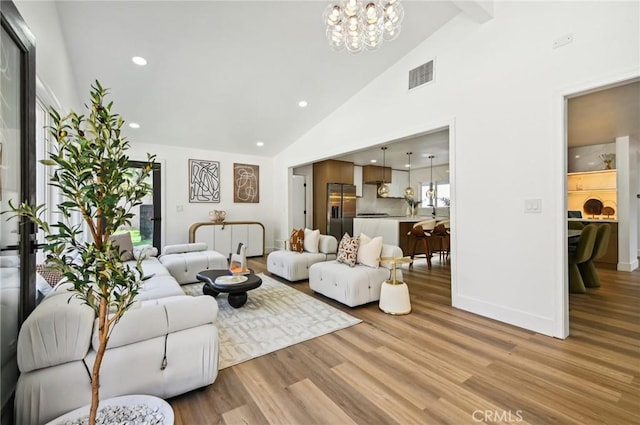4816 Saint Andrews Ave, Buena Park, CA 90621 - living room with healthy amount of natural light, high vaulted ceiling, light wood-type flooring, a chandelier, and recessed lighting