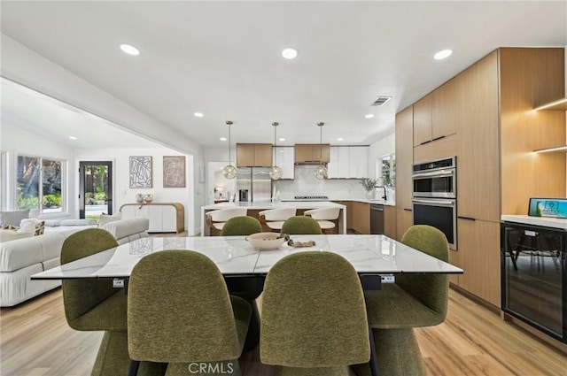 4816 Saint Andrews Ave, Buena Park, CA 90621 - dining space featuring wine cooler, light wood-style floors, and recessed lighting