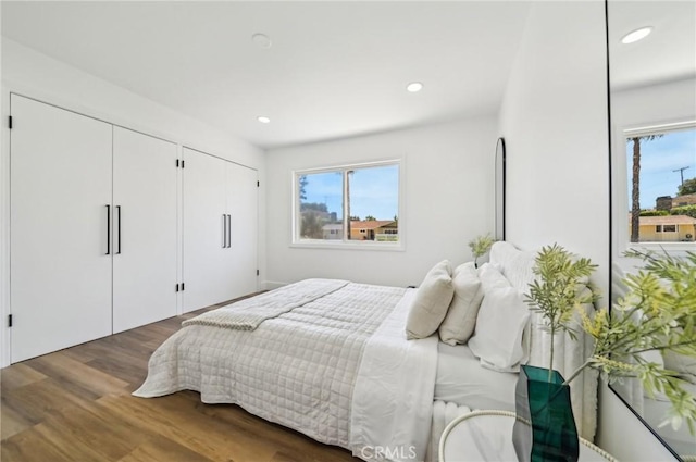 4816 Saint Andrews Ave, Buena Park, CA 90621 - bedroom featuring multiple windows, multiple closets, wood finished floors, and recessed lighting