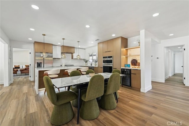 4816 Saint Andrews Ave, Buena Park, CA 90621 - dining area featuring wine cooler, light wood-style flooring, baseboards, and recessed lighting