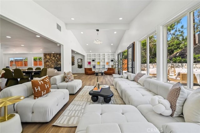 4816 Saint Andrews Ave, Buena Park, CA 90621 - living area featuring wood finished floors, beamed ceiling, high vaulted ceiling, recessed lighting, and a chandelier