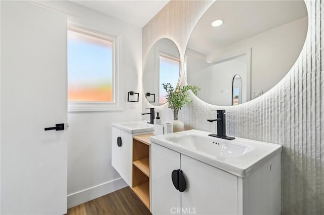 4816 Saint Andrews Ave, Buena Park, CA 90621 - full bath featuring two vanities, wood finished floors, and baseboards