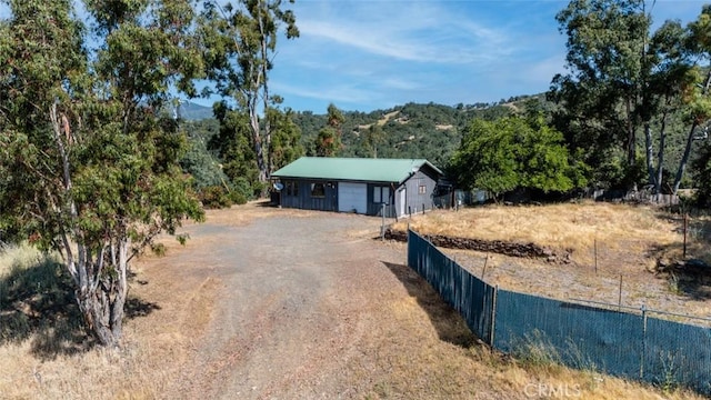 2840 Pear View Rd, Lakeport, CA 95453 - single story home featuring dirt driveway and a wooded view