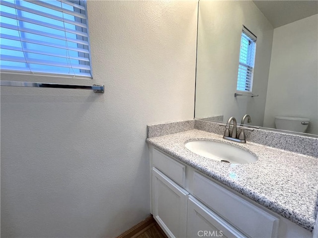 1729 Sunflower Ave Unit A, Glendora, CA 91740 - half bath with vanity, toilet, and a textured wall
